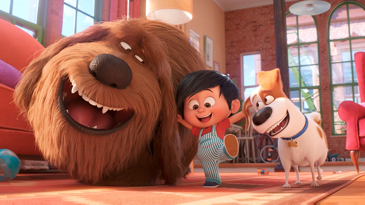 This image released by Universal Pictures shows, from left, Duke, voiced by Eric Stonestreet, Liam, voiced by Henry Lynch and Max, voiced by Patton Oswalt in a scene from 