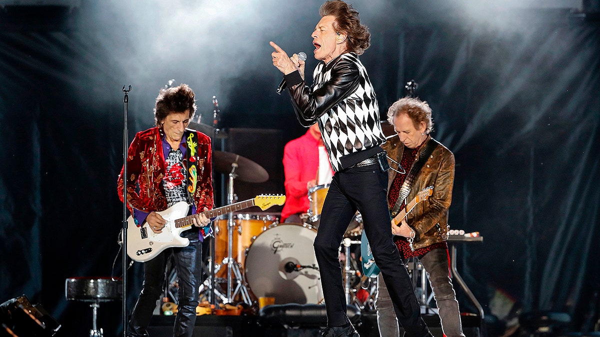 Ronnie Wood (L), Mick Jagger (C), Charlie Watts (partially hidden) and Keith Richards of the Rolling Stones perform as they resume their "No Filter Tour" North American Tour at the Soldier Field on June 21, 2019 in Chicago. (Photo by Kamil Krzaczynski / AFP) (Photo credit should read KAMIL KRZACZYNSKI/AFP/Getty Images)