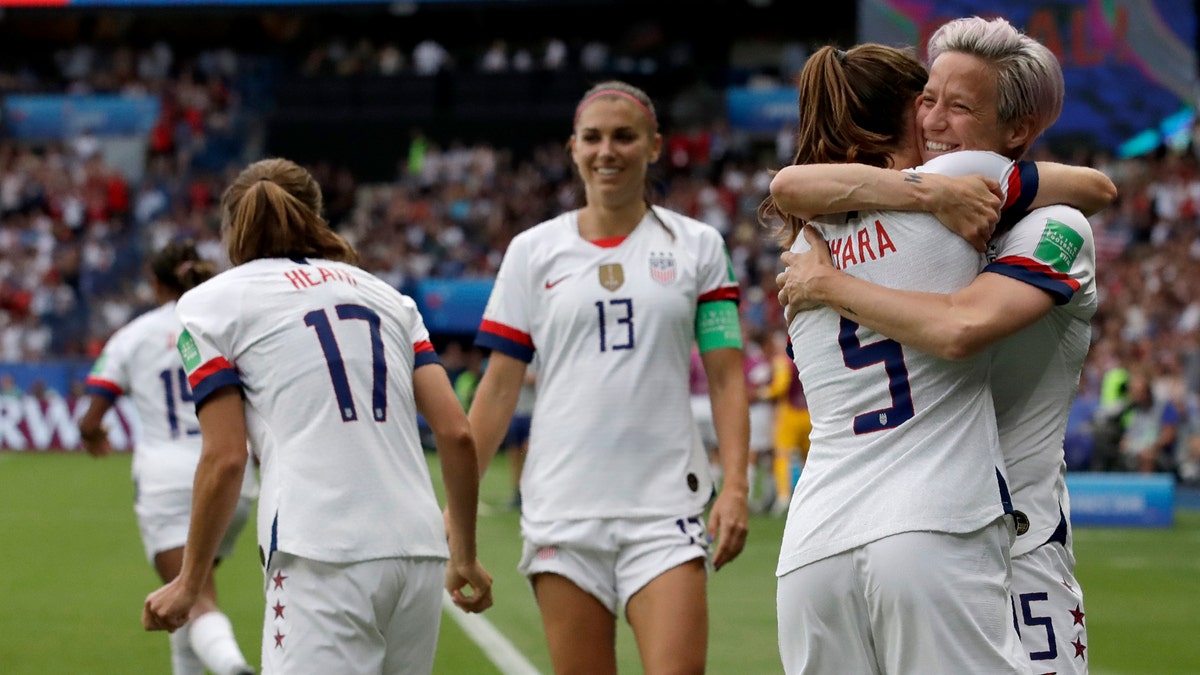 United States' Megan Rapinoe, right, celebrates with teammates after scoring her team's first goal during the Women's World Cup quarterfinal soccer match between France and the United States at Parc des Princes in Paris, France, Friday, June 28, 2019. (AP Photo/Alessandra Tarantino)