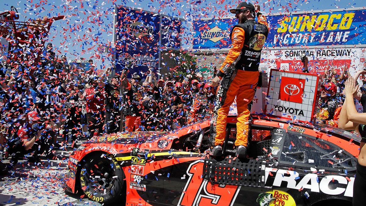 Martin Truex Jr. celebrates after winning a NASCAR Sprint Cup Series auto race Sunday, June 23, 2019, in Sonoma, Calif. (AP Photo/Ben Margot)