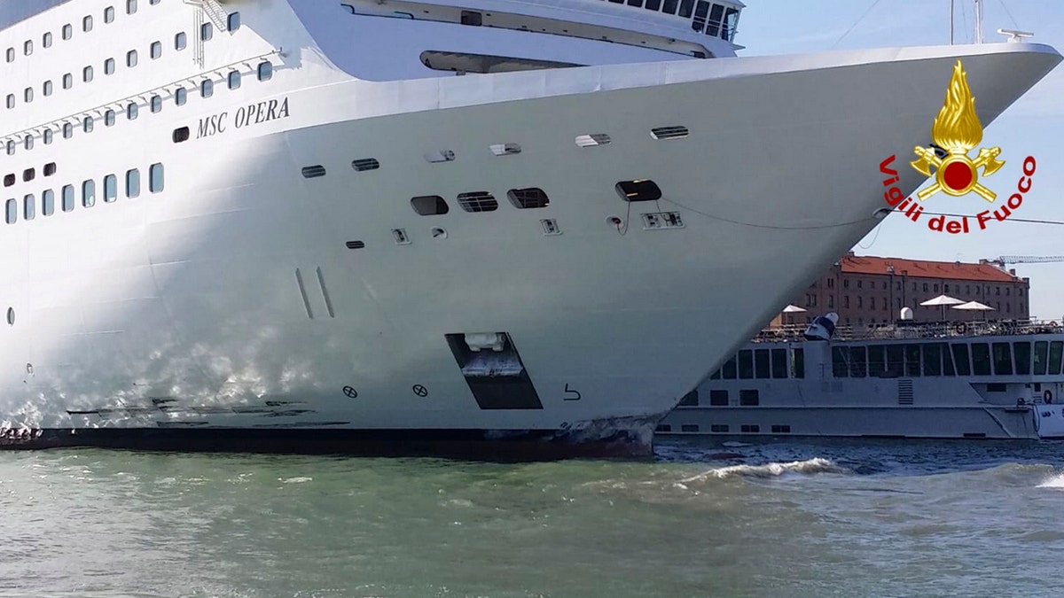 The MSC Opera cruise liner stand by a tourist boat following a collision in Venice, Italy, Sunday, June 2, 2019.