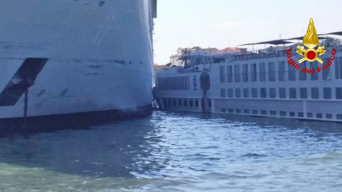 The MSC Opera cruise liner stand by a tourist boat following a collision in Venice, Italy, Sunday, June 2, 2019.