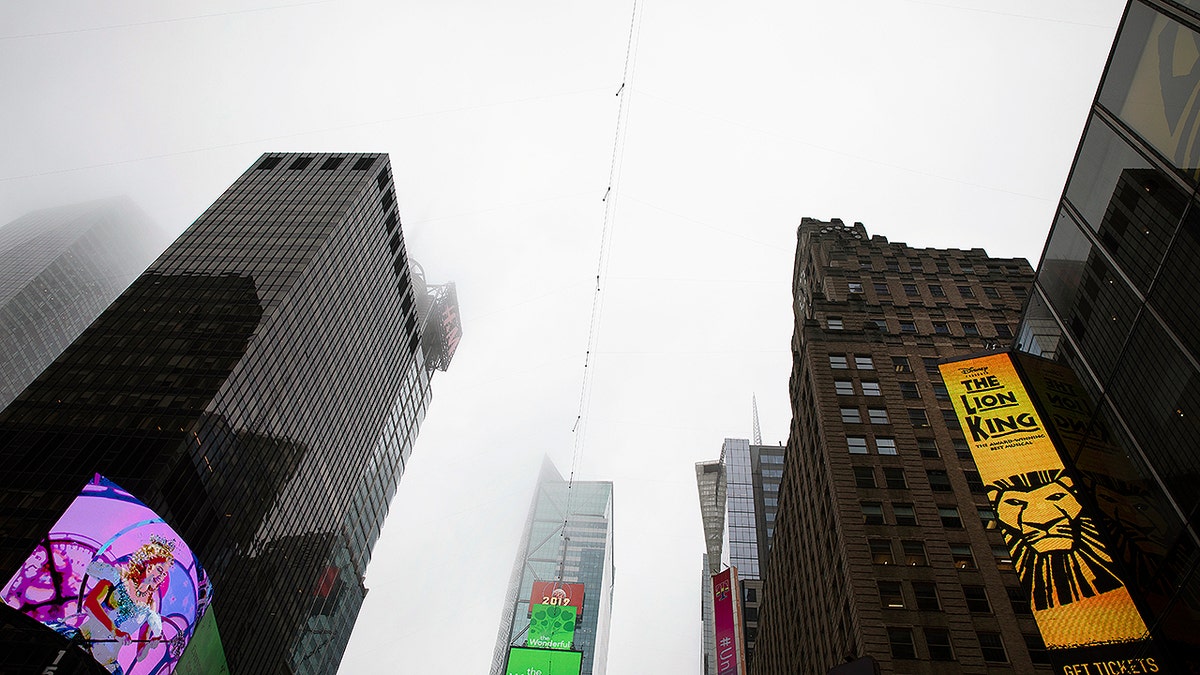 A high-wire crosses Times Square, Thursday, June 20, 2019 in New York. Performers Nik and Lijana Wallenda will cross Times Square on the high wire on Sunday. (AP Photo/Mark Lennihan)