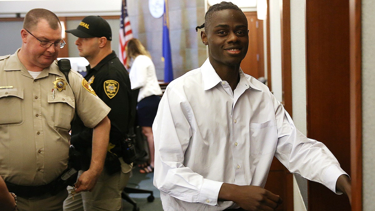 Weslie Martin, accused of burglarizing Wayne Newton's home, is escorted out of the courtroom following his hearing at the Regional Justice Center in Las Vegas, Friday, June 21, 2019. A Nevada jury found martin, a 22-year-old state prison inmate guilty of burglarizing the mansion of 