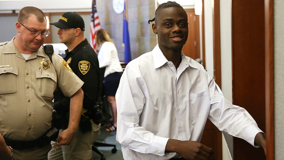 Weslie Martin, accused of burglarizing Wayne Newton's home, is escorted out of the courtroom following his hearing at the Regional Justice Center in Las Vegas, Friday, June 21, 2019. A Nevada jury found martin, a 22-year-old state prison inmate guilty of burglarizing the mansion of