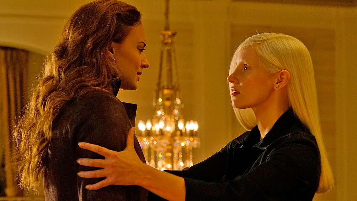 This image released by Twentieth Century Fox shows Sophie Turner, left, and  Jessica Chastain in a scene from 