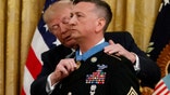 President Donald Trump awards the Medal of Honor to Army Staff Sgt. David Bellavia in the East Room of the White House in Washington, Tuesday, June 25, 2019, for conspicuous gallantry while serving in support of Operation Phantom Fury in Fallujah, Iraq. (AP Photo/Carolyn Kaster)