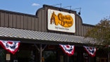 The old logo on the outside of a Cracker Barrel restaurant