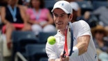 FILE - In this Aug. 27, 2018, file photo, Andy Murray, of Britain, returns a shot to James Duckworth, of Australia, during the first round of the U.S. Open tennis tournament in New York. Three-time major champion Murray is planning to return from hip surgery by competing in doubles at the Queen's Club tournament this month. (AP Photo/Andres Kudacki, File)