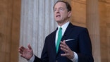 FILE - In this Oct. 2, 2018, file photo, Sen. Pat Toomey, R-Pa., speaks during a television news interview on Capitol Hill in Washington. For years the federal government for years has kept under wraps the names of hundreds of nursing homes around the country found to have serious health, safety or sanitary problems. Lawmakers say the silence calls into question the government’s commitment to families going through the difficult process of finding a nursing home for a loved one. The secrecy began to crack June 3, 2019, when two U.S. senators from Pennsylvania released the government’s list.. (AP Photo/J. Scott Applewhite, file)