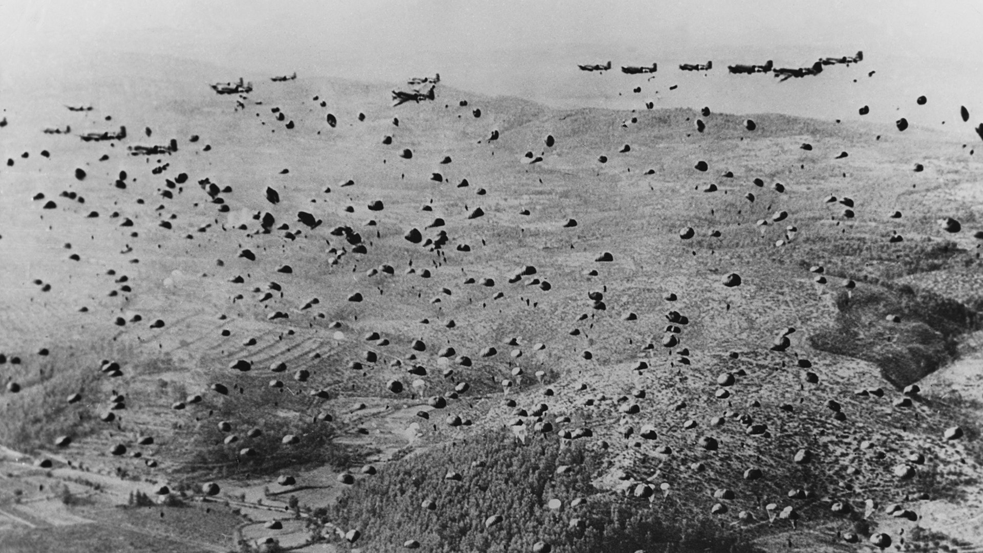Hundreds of paratroopers pictured in the water as they storm Normandy