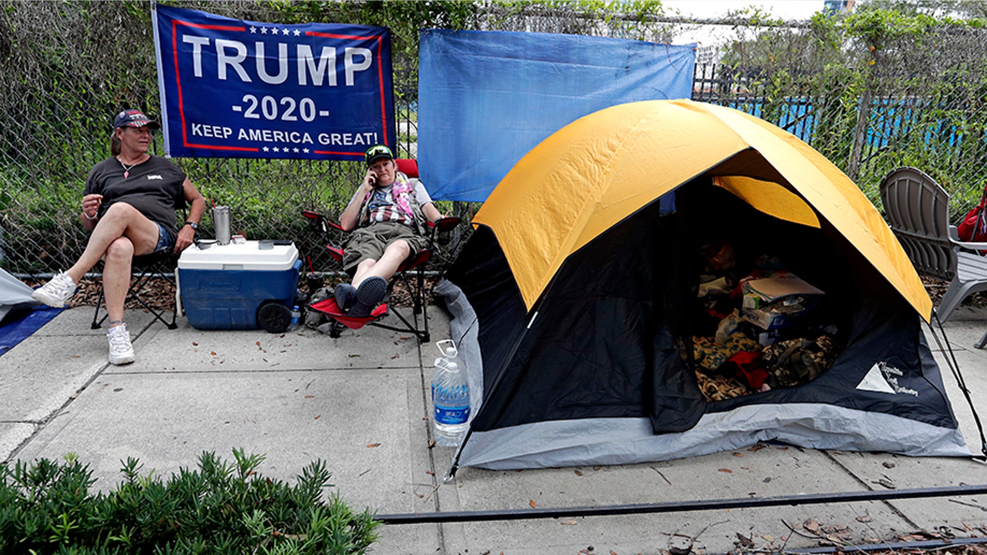 Anna Connelly and Jeanna Gullett made camp as they waited to attend the rally for President Trump. (AP Photo/John Raoux)