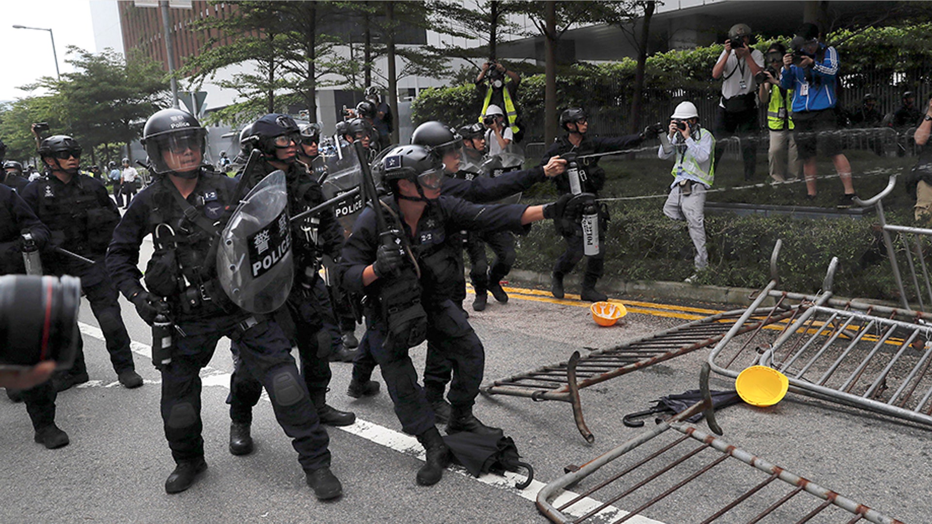 Police use pepper spray on protesters near the Legislative Council in Hong Kong, June 12, 2019. 