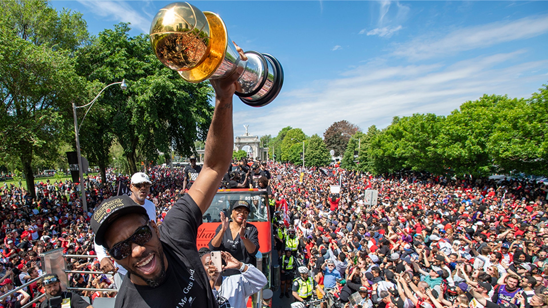Toronto Raptors' Kawhi Leonard holds up his MVP trophy during the team's NBA basketball championship parade in Toronto, June 17, 2019. 