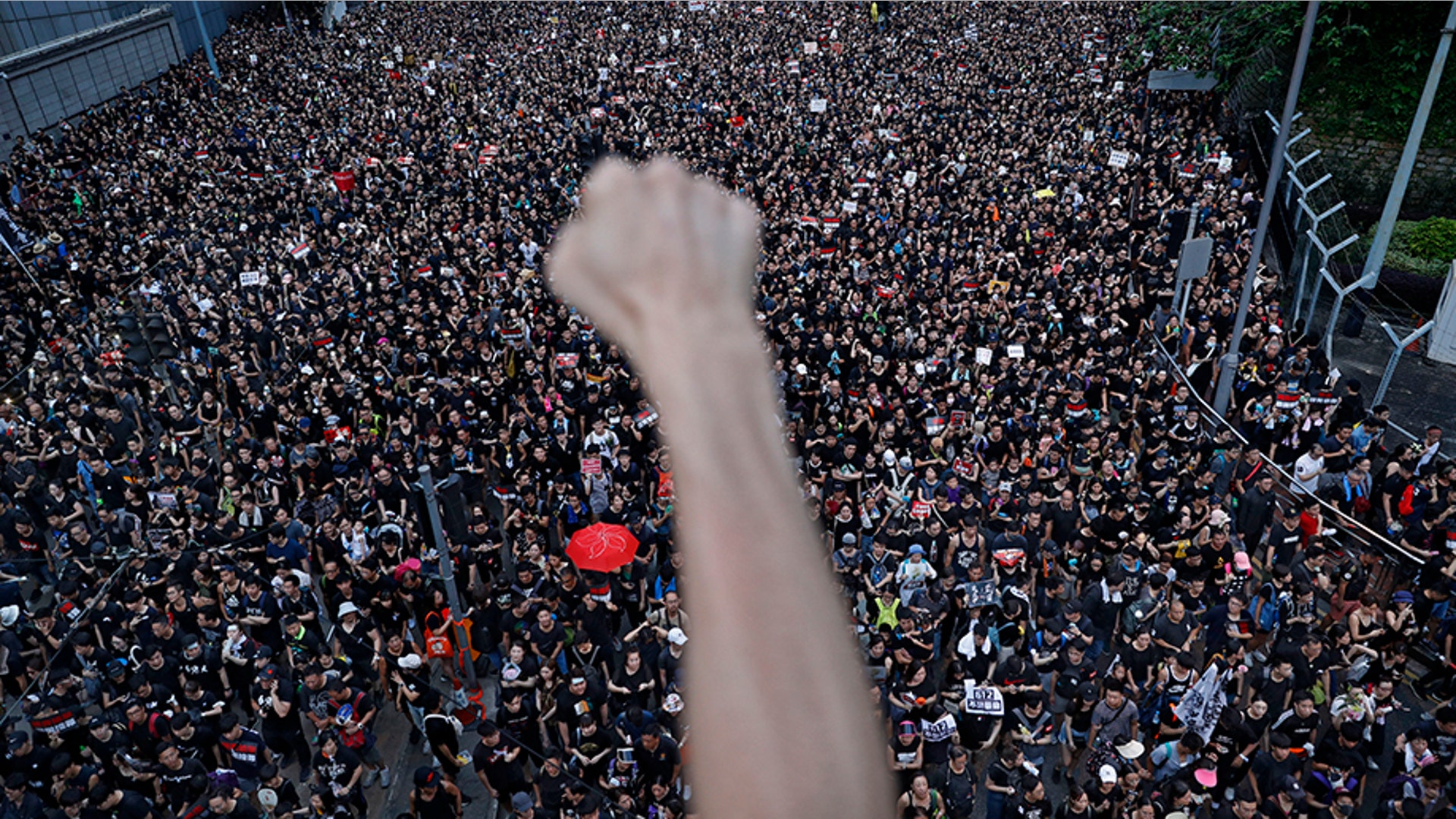 Protesters march in the streets against an extradition bill in Hong Kong, June 16, 2019. 