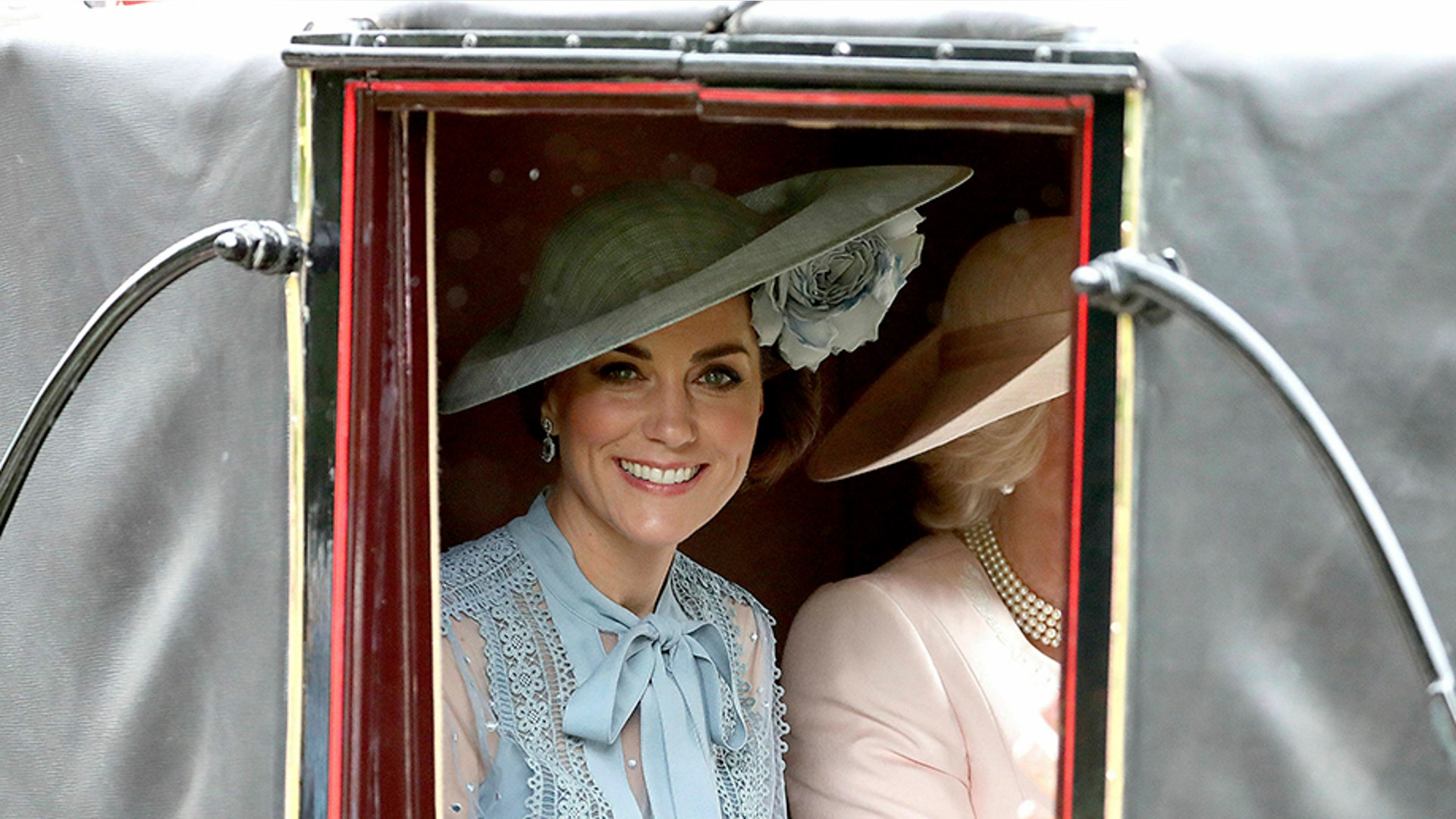 Britain's Kate, Duchess of Cambridge looks out from a carriage on her way to Royal Ascot horse race meeting in Ascot, England, June 18, 2019. 