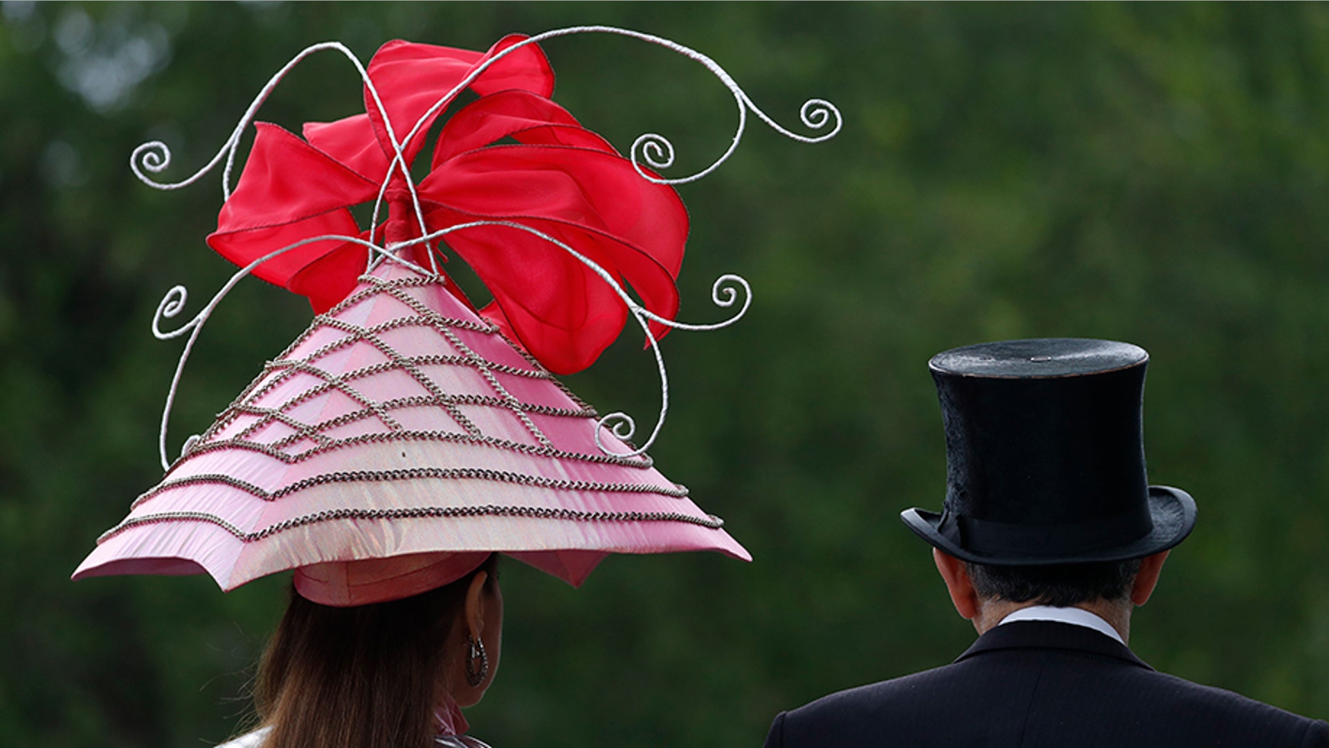 Racegoers arrive on the second day of the annual Royal Ascot horse race meeting in Ascot, England, June 19, 2019. 