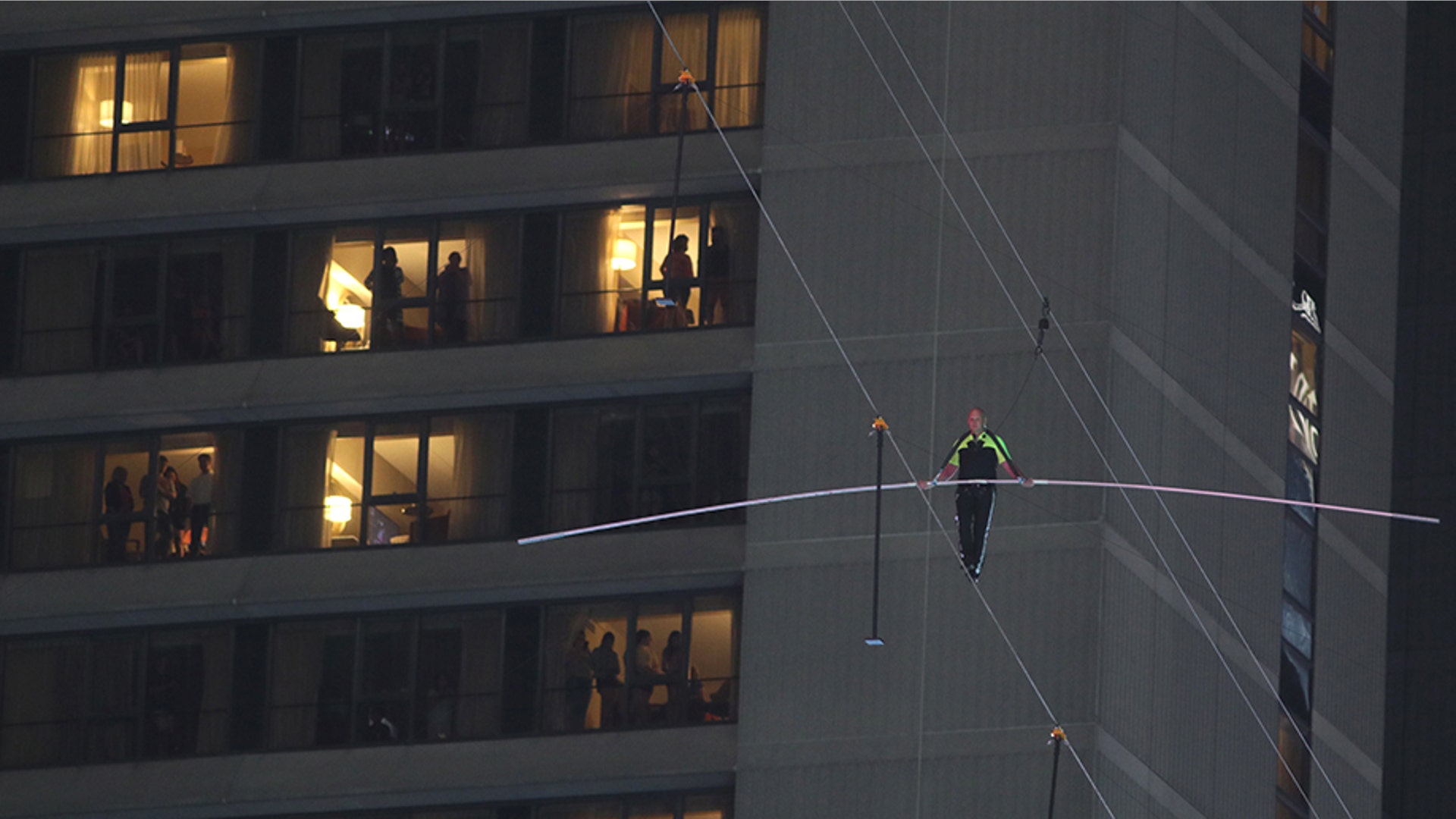 Nik Wallenda walks past the Marriott Marquis Hotel on a high wire above Times Square in New York City, June 23, 2019. 