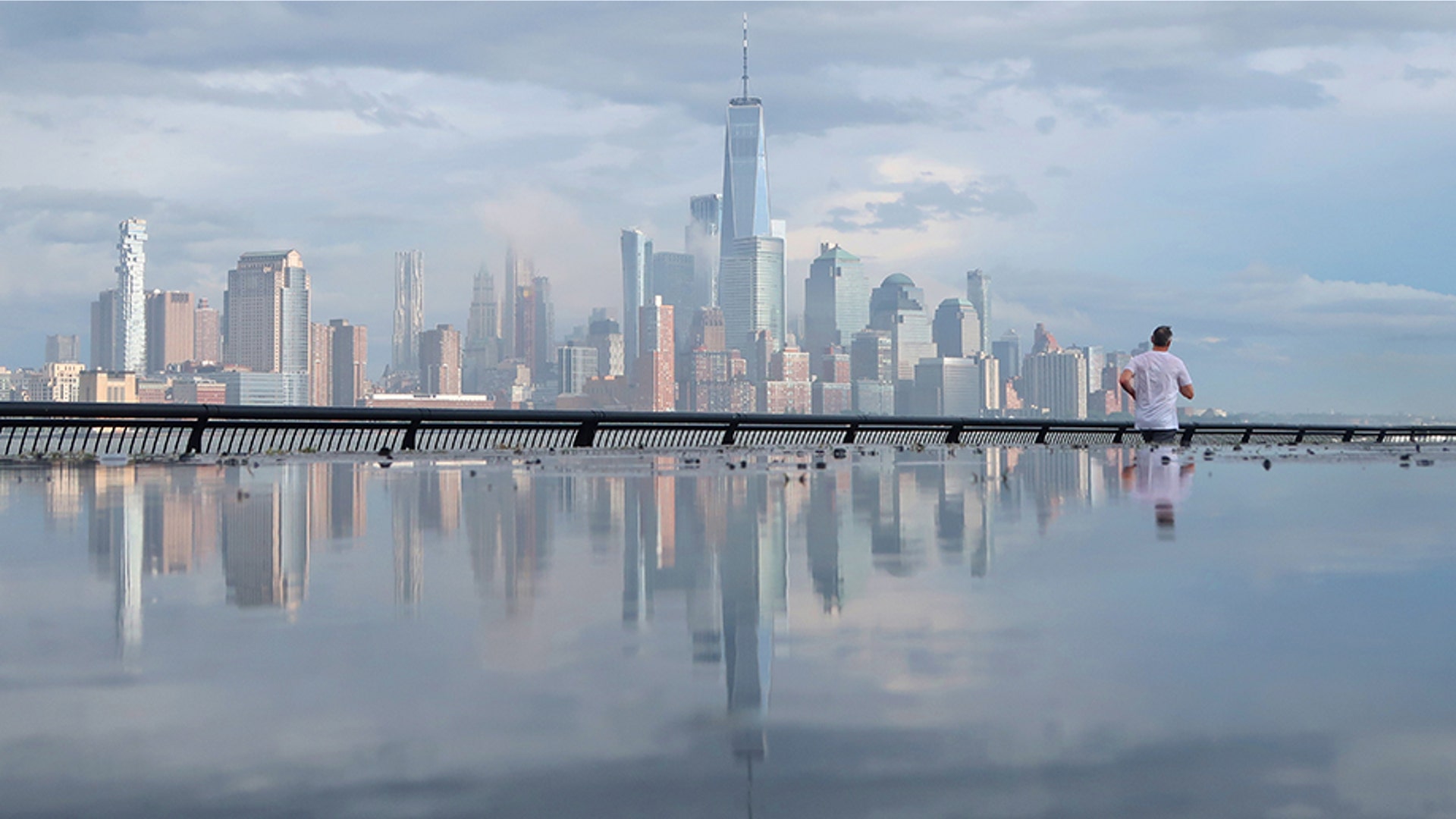 A layer of fog lifts above the skyline of lower Manhattan and One World Trade Center in New York City, June 20, 2019. 