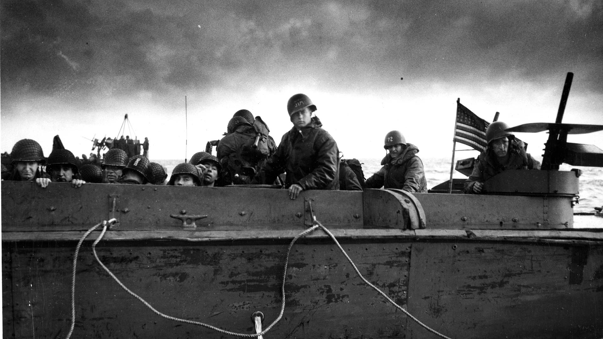 Tide Prediction Machine - The Allies had put serious consideration into where the invasion of Nazi-occupied Europe should occur, but it was up to British mathematician Arthur Thomas Doodson to provide the when. He started working with tide-prediction machines and in 1944, using a modified device he was able to identify the three ideal days for a landing in early June. While weather delayed the scheduled June 5 landings, Doodson's calculations ensured that the Allies had the right window for a low tide landing. This photo shows US soldiers on a Coast Guard vessel as it crosses the English Channel to deliver reinforcements to the French coast during D-Day operations, early June 1944.