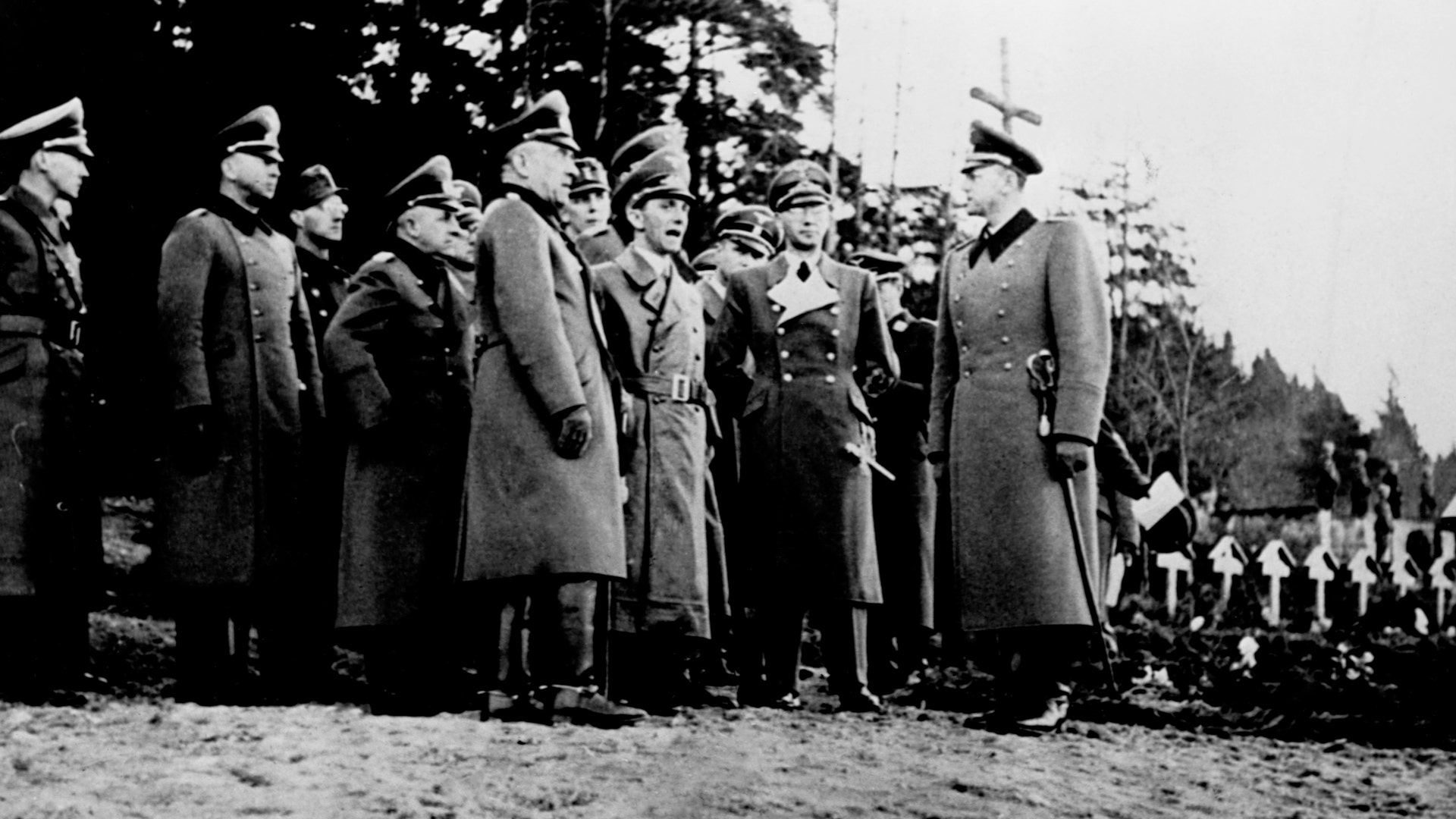 Fortitude North - The effectiveness of Fortitude North has been debated for years, but the deception efforts – which were coordinated from Edinburgh Castle and consisted of the fake British Fourth Army – helped convince the Germans that an invasion would land in Norway. The naming of the fictional army is notable as the Fourth Army did exist in the First World War and took part in the Battle of the Somme and was to mount Operation Hush, an amphibious landing on the Belgian coast. As a result of Fortitude North, 13 German army divisions remained stationed in Norway. This image is a file photo of Nazi officials, including Joseph Goebbels, visiting a war cemetery in Norway.