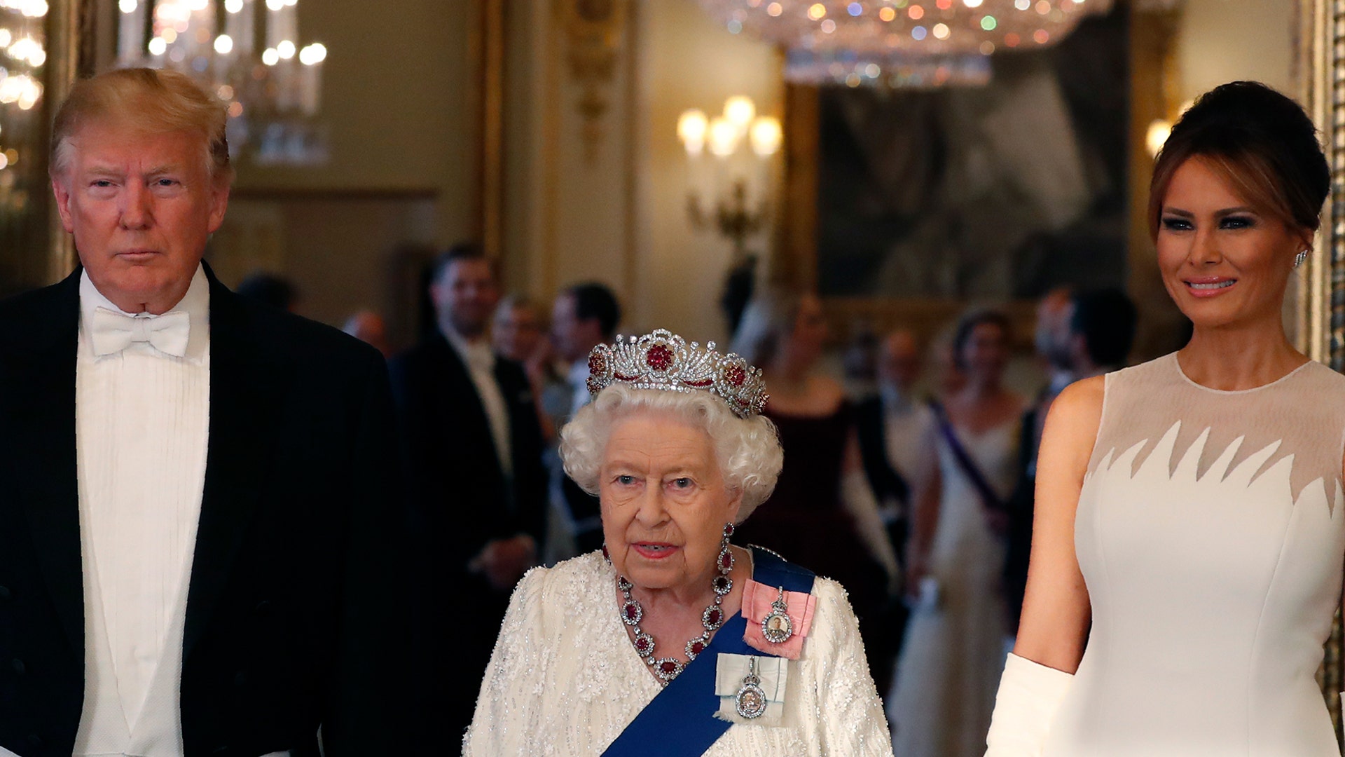 Queen Elizabeth II, center, posing for a photo with President Trump and first lady Melania Trump ahead of the state banquet at Buckingham Palace.