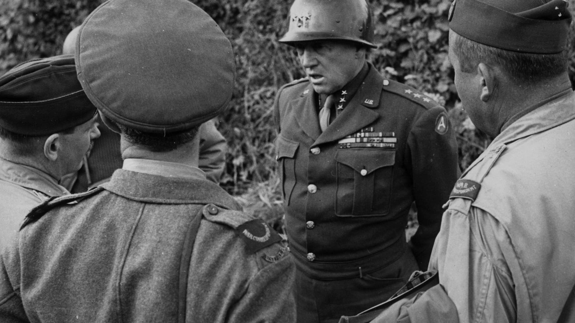 Fortitude South - The southern counterpart to Fortitude North was to convince the Germans that the main invasion would come at the Pas de Calais region of France, east of Normandy, while the Normandy landings were only a feint. It has been argued that Fortitude South had the advantage of being the plan that German dictator Adolf Hitler wanted to believe would occur and thus he never accepted that Normandy was the actual invasion.The invasion was to be carried out by the First United States Army Group (FUSAG), under the command of the very real General George S. Patton. This photo from August 1944 shows Patton talking to Allied war correspondents in Normandy.