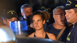 Captain of migrant vessel arrested, accused of trying to sink police boat
