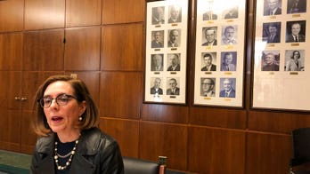 Oregon governor sends out state police to find GOP lawmakers skipping climate vote
