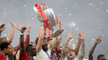 Liverpool’s goalkeeper puts his faith on display after winning Champions League: 'God is love!'