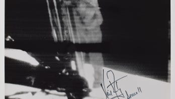 Apollo 11: 'Giant leap' photo signed by Neil Armstrong sells for $52G