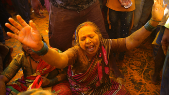 AP PHOTOS: Hindu festival showers Indian town with turmeric