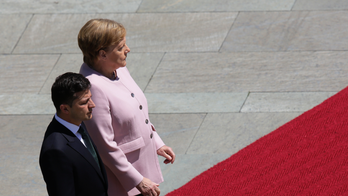 Germany's Merkel appears unsteady, shaking at ceremony