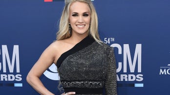 Carrie Underwood performs 'Drinking Alone' with wine from her couch
