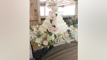 Couple creates DIY wedding cake from Costco sheet cakes and Trader Joe's flowers, spends less than $50