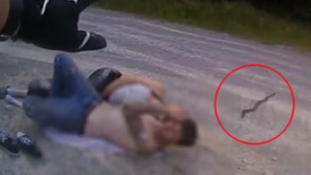 Body cam video: Tennessee deputy saves two people from rattlesnake