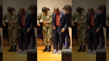 Father's Day made: Dancing pastor falls over when Navy daughter surprises him at church