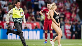Swimsuit model streaks Champions League final to promote beau's adult website