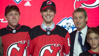 Devils select US center Hughes with 1st pick in NHL Draft
