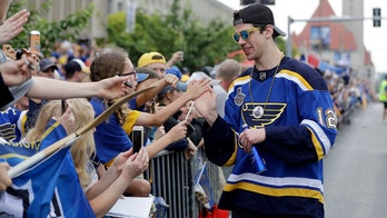 St. Louis Blues' Zach Sanford appears to puke on himself during victory parade
