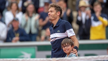 French tennis star Nicolas Mahut shares heartwarming moment with son on court after French Open loss