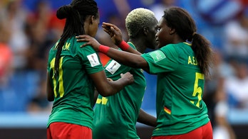 Cameroon player appears to spit on opponent during heated match