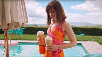 Dunkin' is giving away latte-toting tank tops, but there's a catch