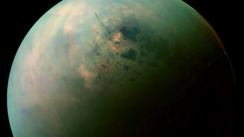 Mysterious 'bathtub rings' around Titan's lakes could be made of 'alien crystals,' study says