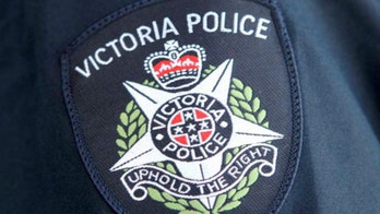 Armed police interrupt Australian funeral to enforce coronavirus social distancing: report