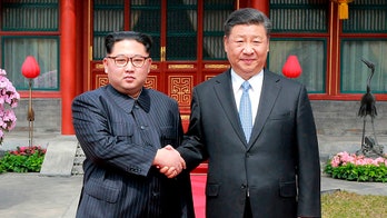 Kim Jong Un may use summit with Xi to send nuke deal message to Trump, defector says