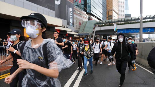 Violence breaks out in Hong Kong as protesters challenge bill allowing criminal suspects to be tried in mainland China