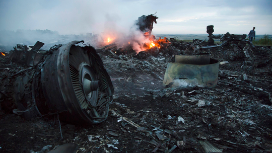 The Latest: Mother says 4 people to be tried over MH17 crash