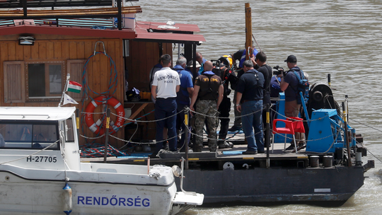 The Latest: Hungary: Divers try to recover bodies from boat