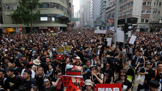 Hong Kong's leader apologizes after extradition bill fuels massive protests